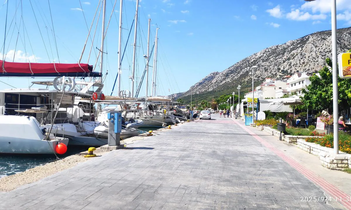 These boats are more stern to and bows to the main promenade in Astakos. As you see, they have access to power and water.